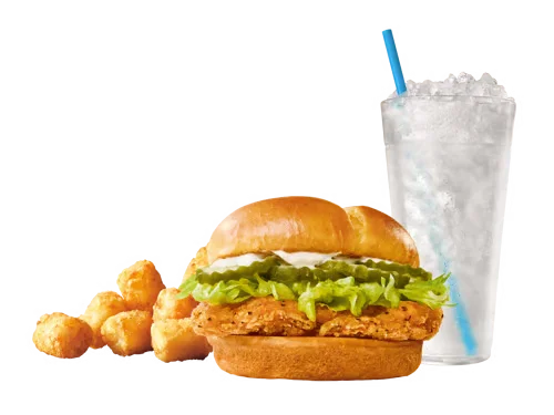 Sonic Menu Prices, Calories & Updated Deals 2026 21 Crispy Chicken Sandwich Combo featuring a crunchy breaded chicken fillet with lettuce, tomato, and mayo on a toasted bun, served with fries and a soft drink.