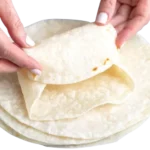 The Sonic SuperSONIC Breakfast Burrito: A Complete Overview 8 Fluffy flour tortillas heated and prepared for assembling a bacon breakfast burrito